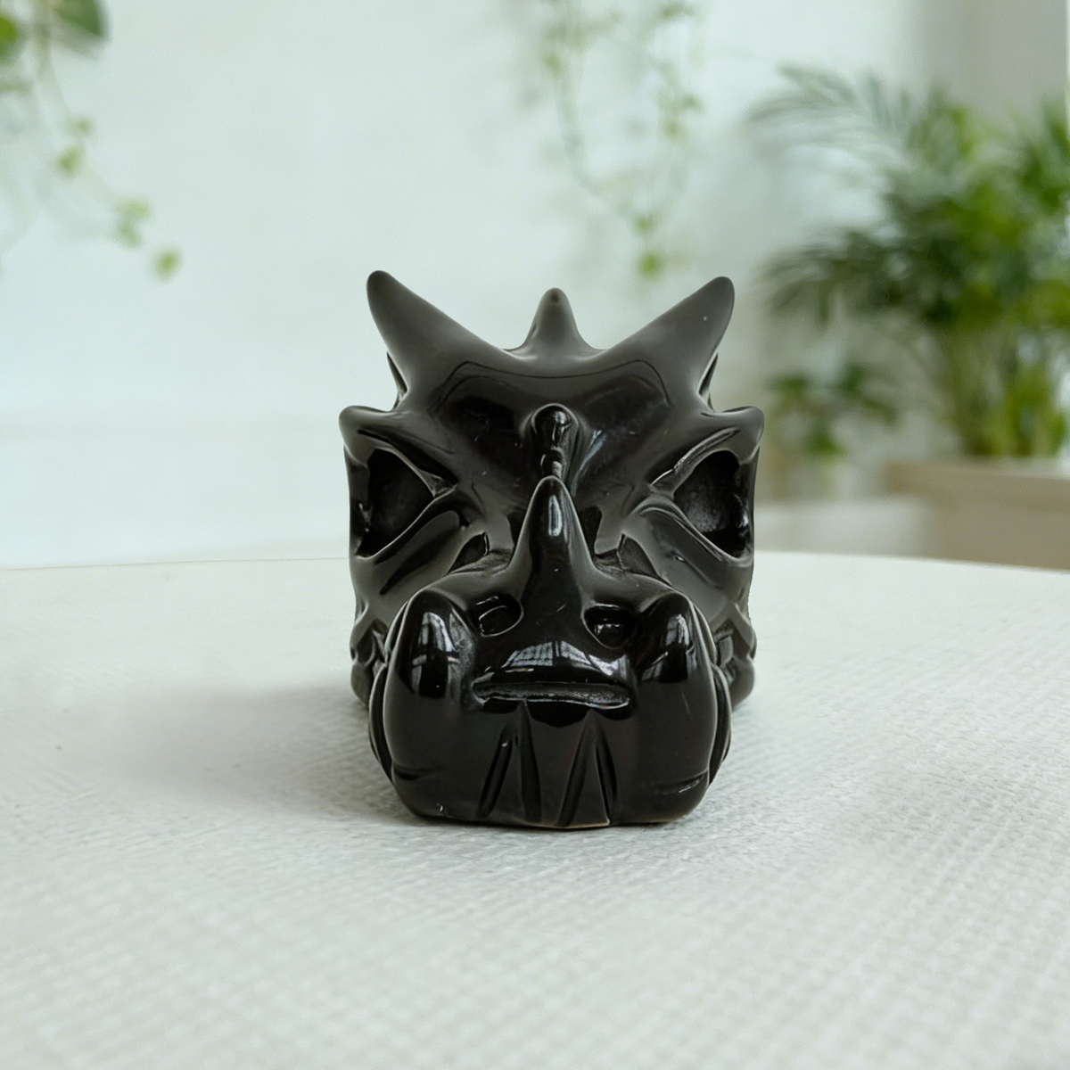 Additional view of a 2-inch Black Obsidian dragon skull carving