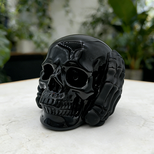 Additional view of a Black Obsidian Hear No Evil skull carving