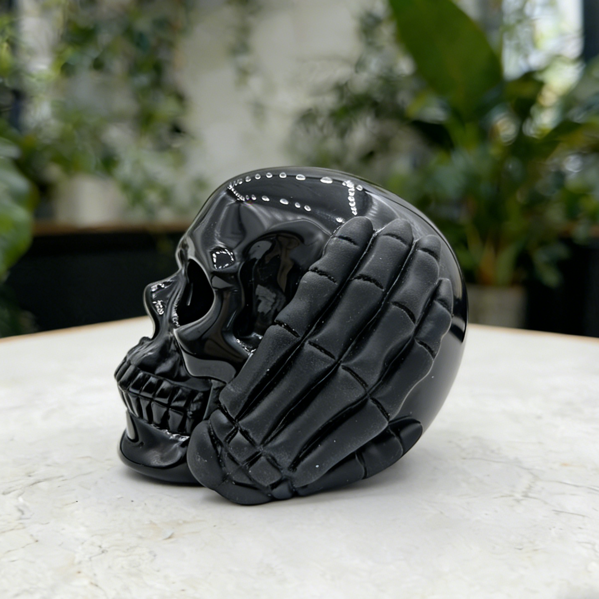 Additional view of a Black Obsidian Hear No Evil skull carving