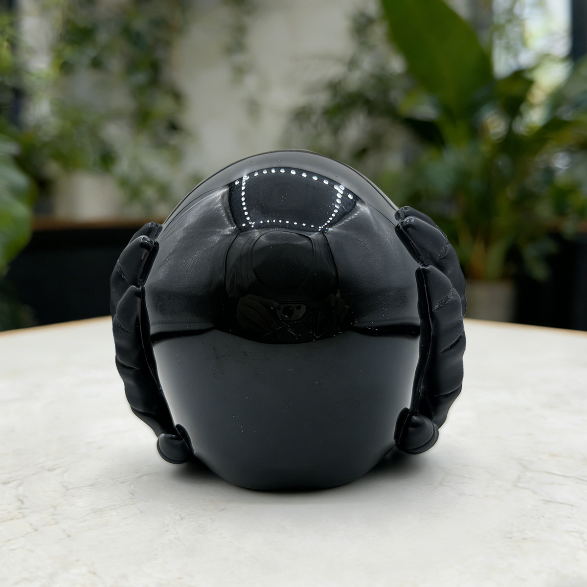 Additional view of a Black Obsidian Hear No Evil skull carving