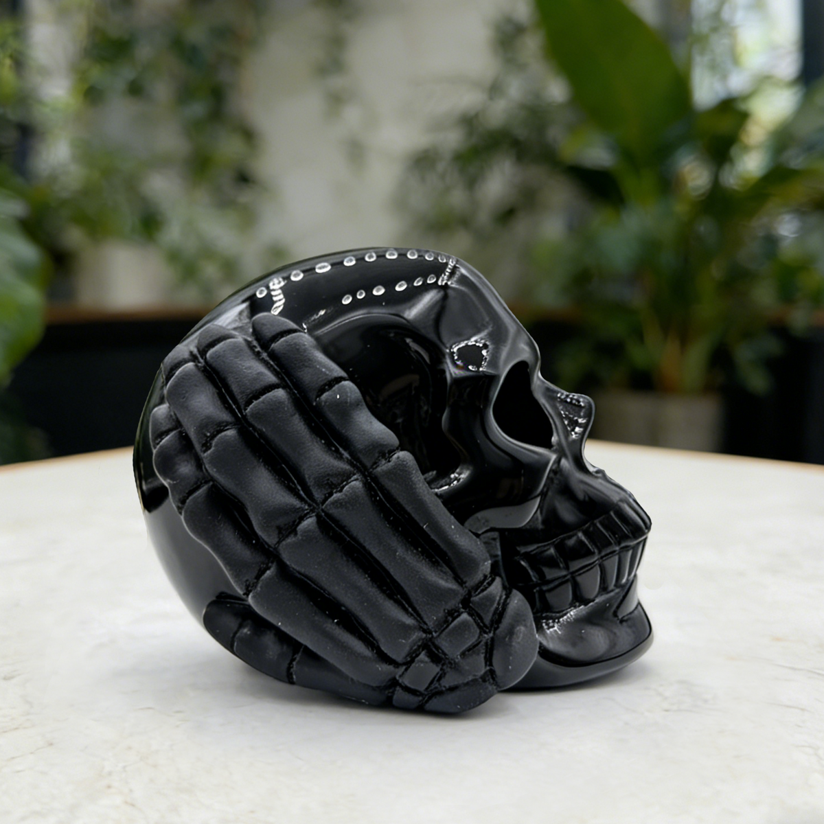Additional view of a Black Obsidian Hear No Evil skull carving