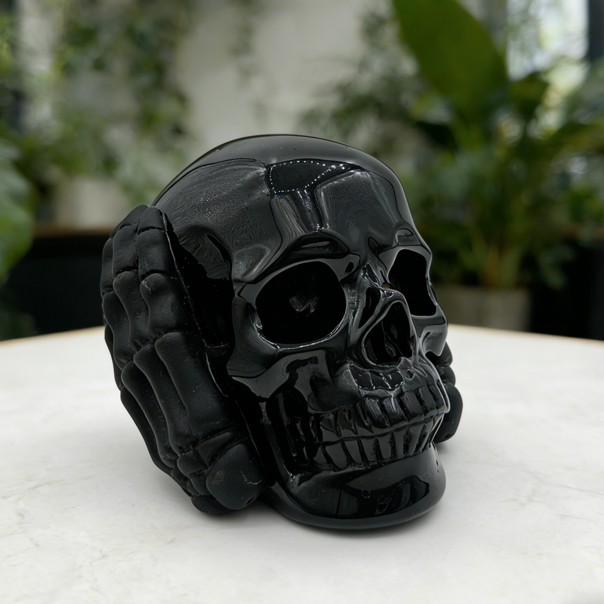 Additional view of a Black Obsidian Hear No Evil skull carving