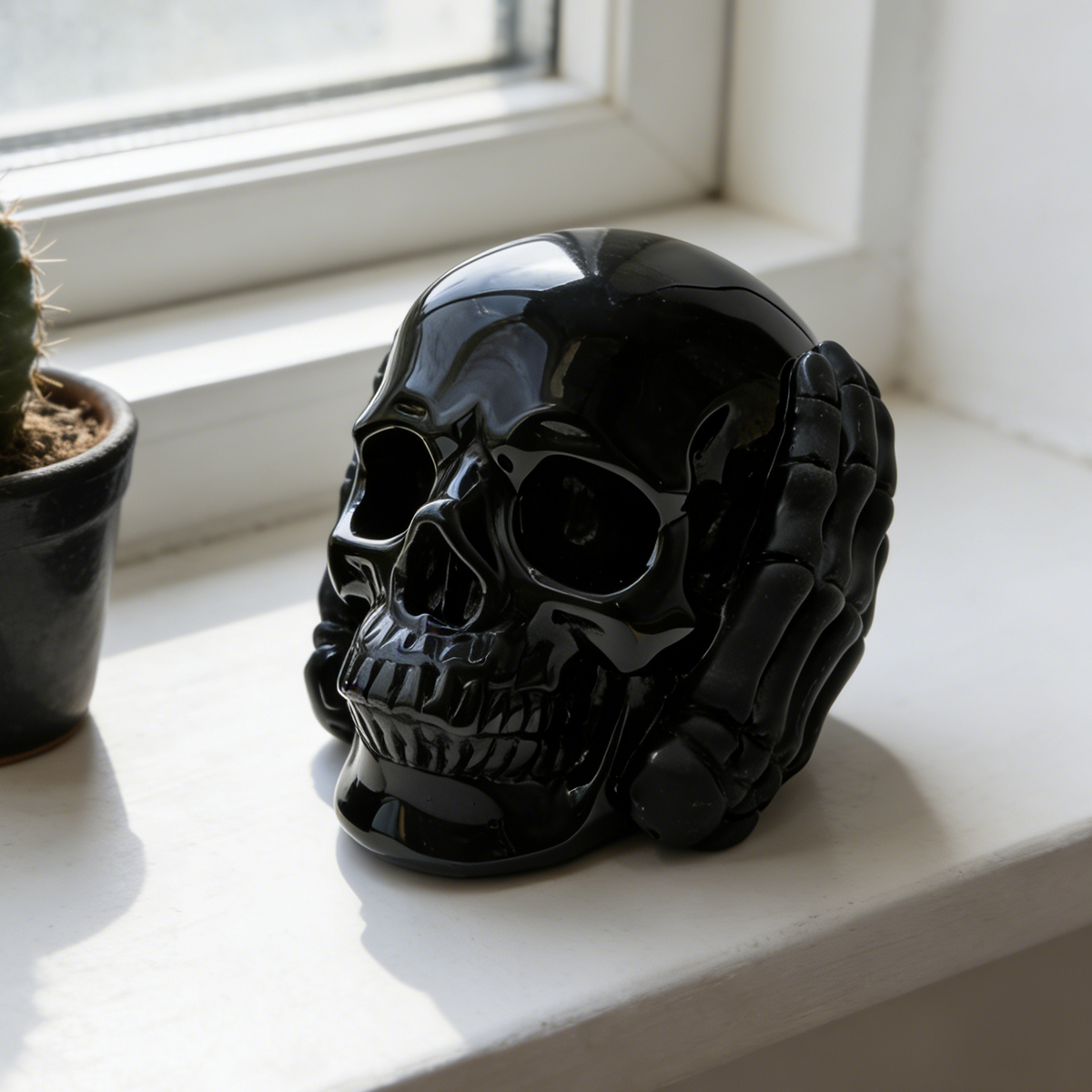Additional view of a Black Obsidian Hear No Evil skull carving