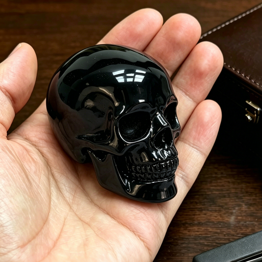 Additional view of a 2-inch Black Obsidian human skull carving