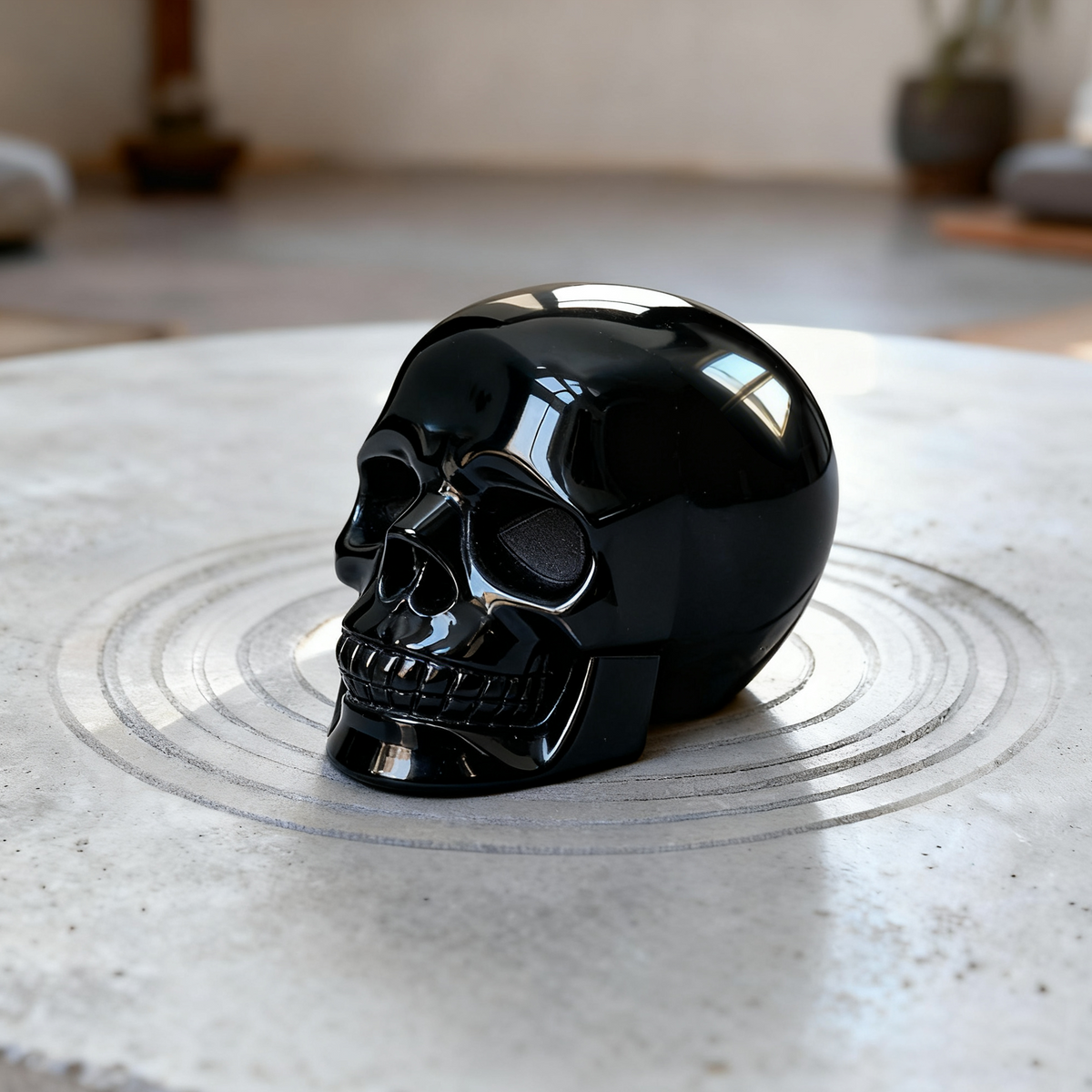 Additional view of a Black Obsidian human skull carving