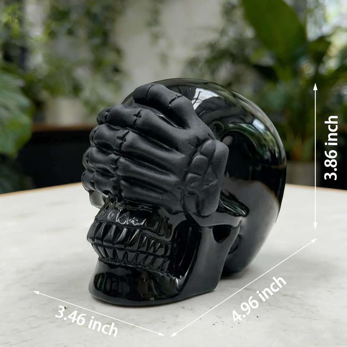 Additional view of a Black Obsidian See No Evil skull carving