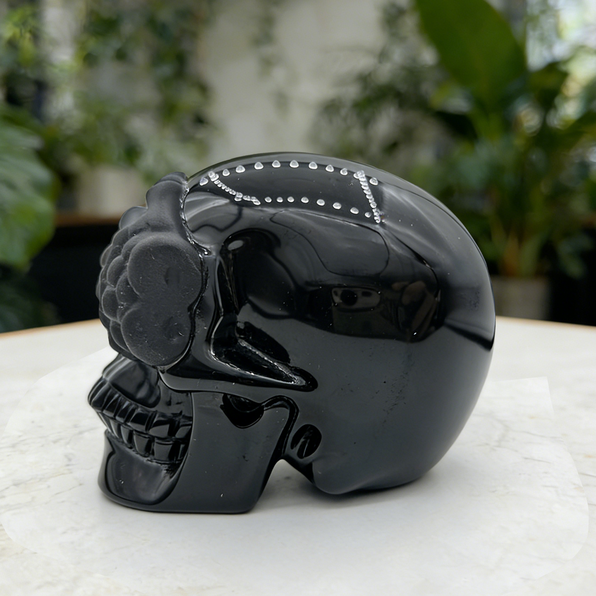 Additional view of a Black Obsidian See No Evil skull carving