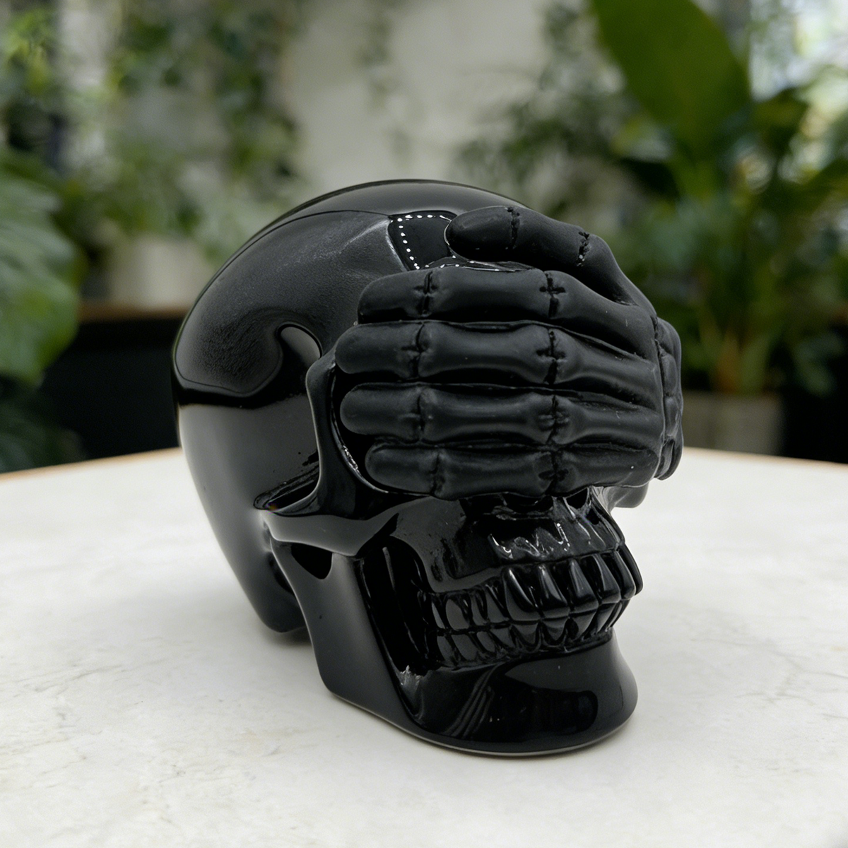 Additional view of a Black Obsidian See No Evil skull carving
