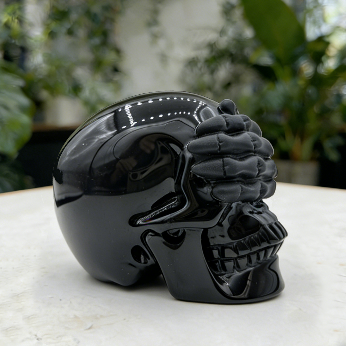 Additional view of a Black Obsidian See No Evil skull carving
