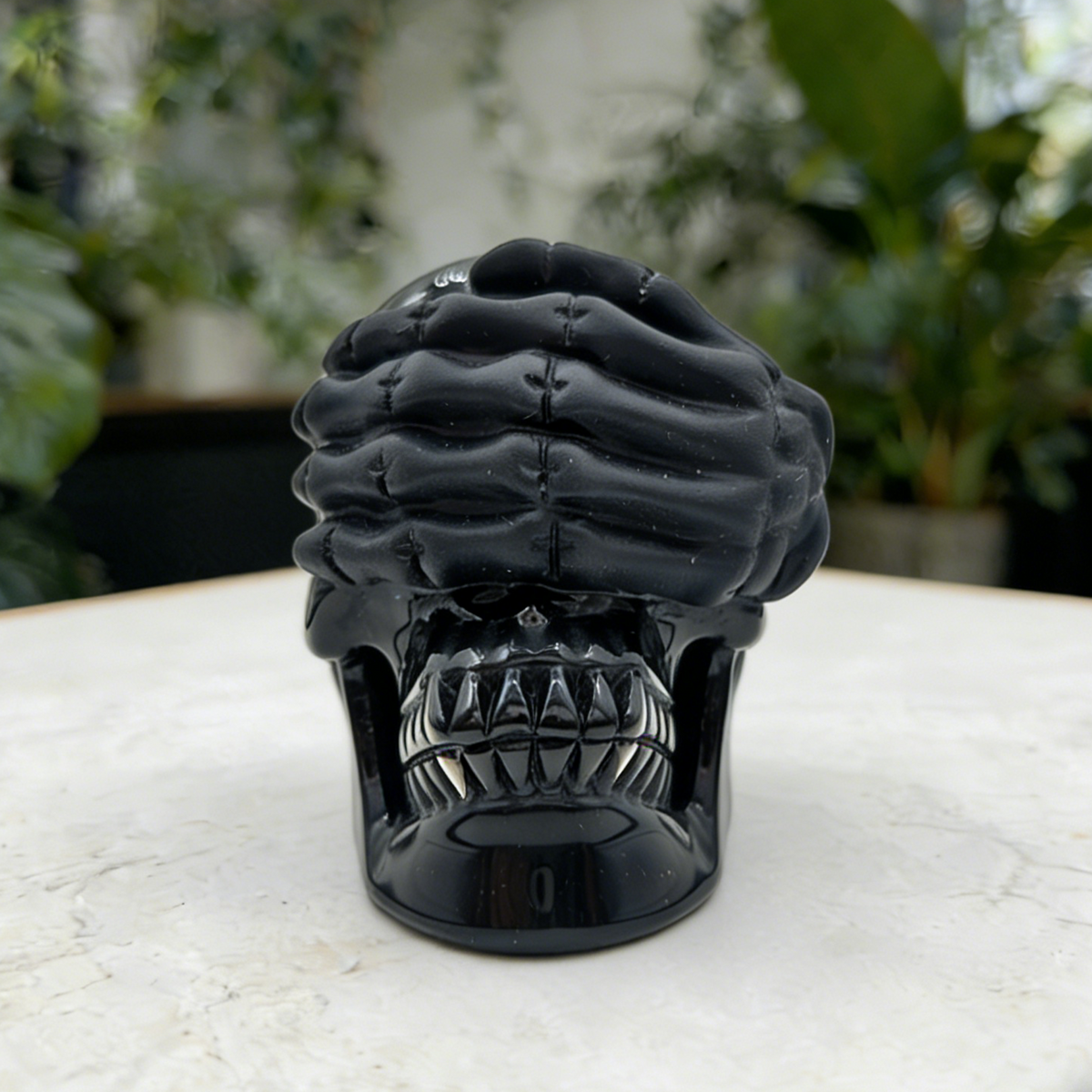 Additional view of a Black Obsidian See No Evil skull carving