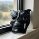 Additional view of a Black Obsidian skull with frosted butterfly mask sculpture