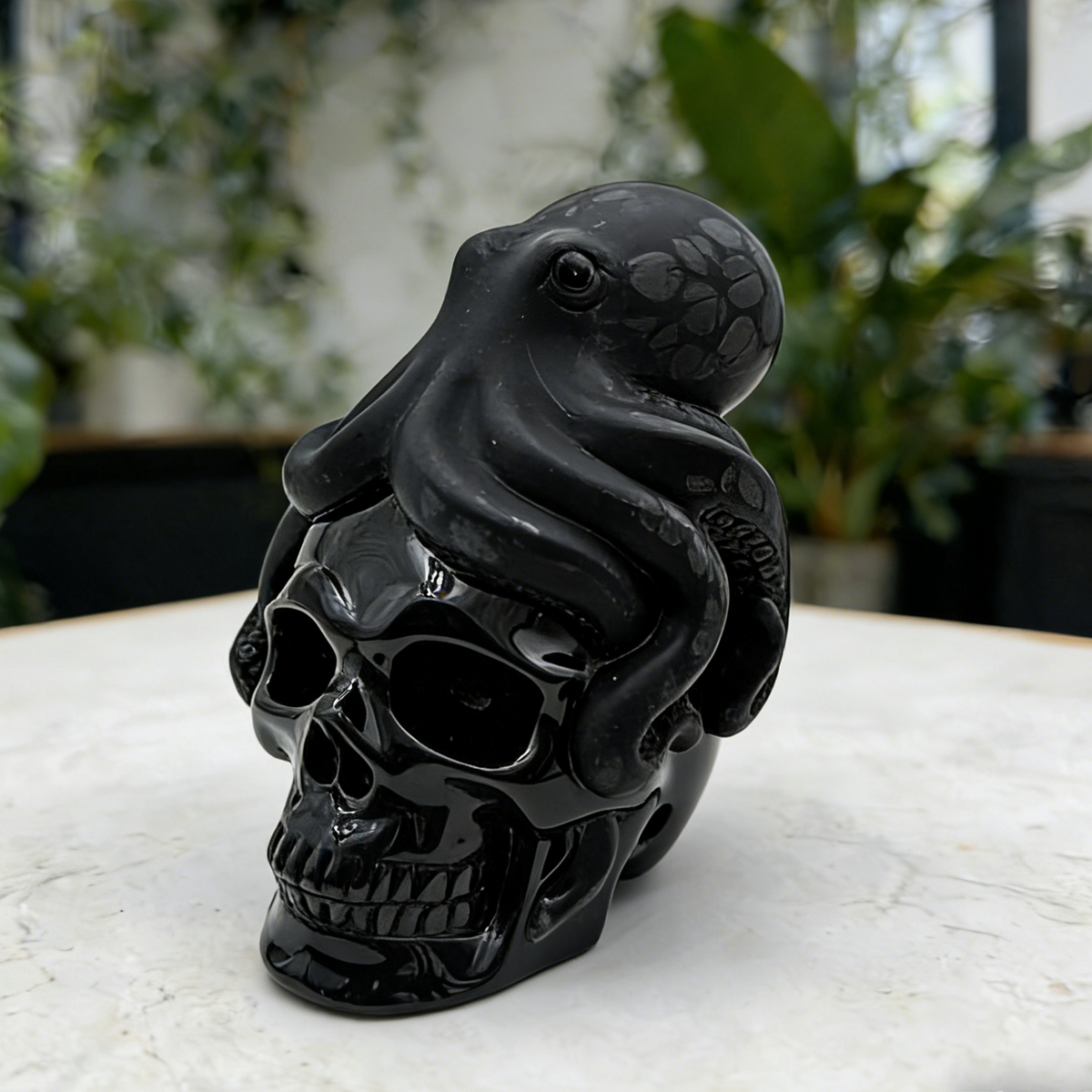 Additional view of a Black Obsidian skull and octopus sculpture