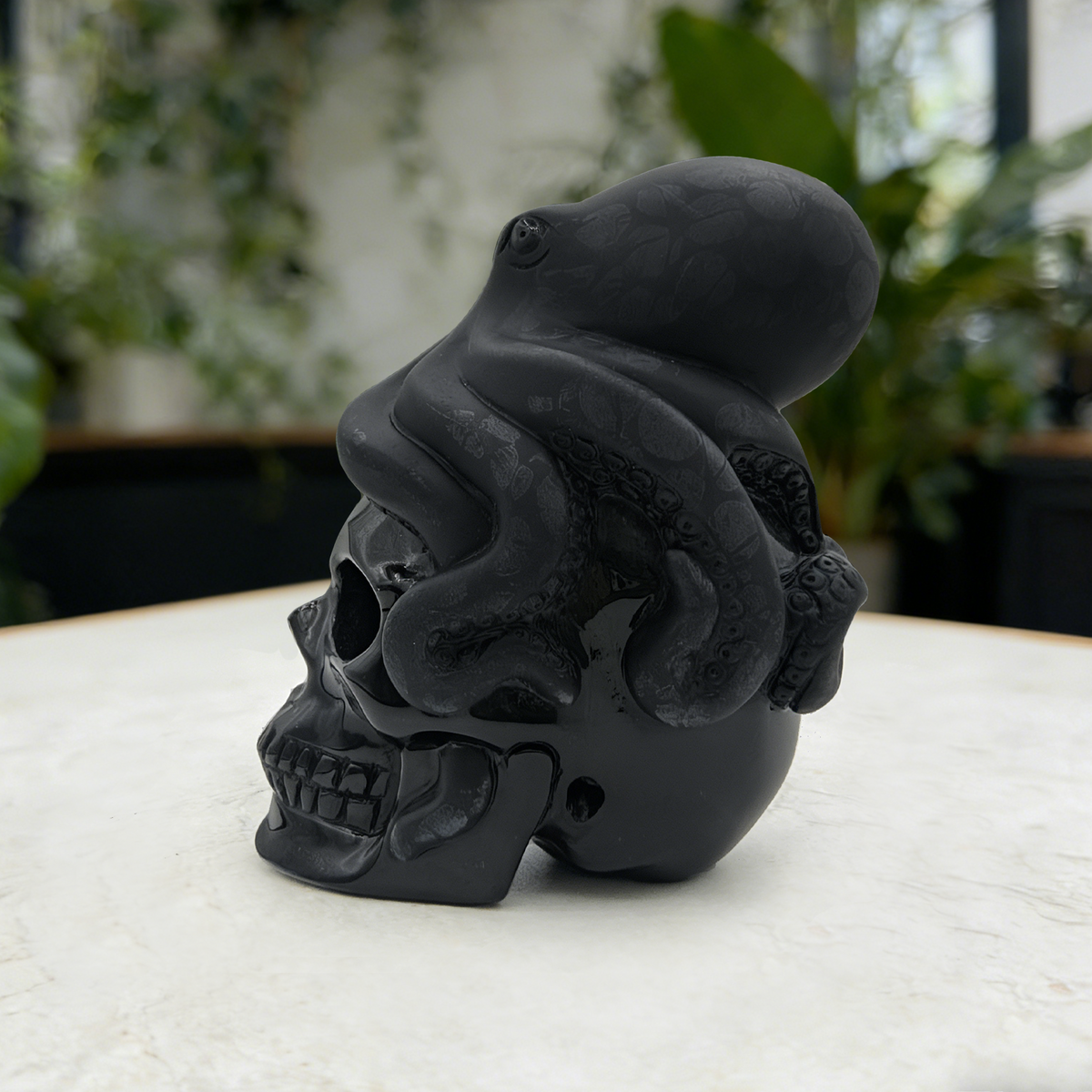 Additional view of a Black Obsidian skull and octopus sculpture