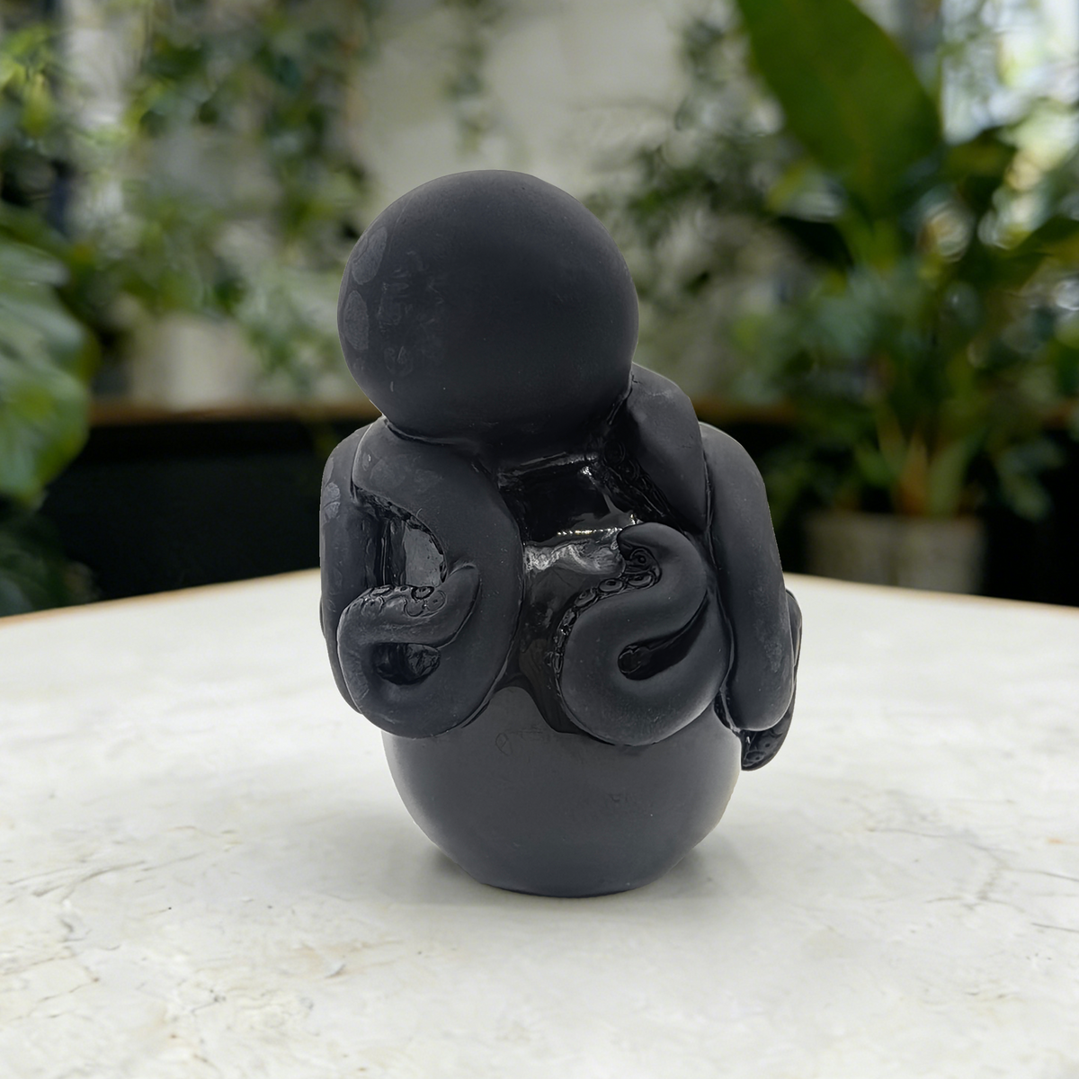 Additional view of a Black Obsidian skull and octopus sculpture