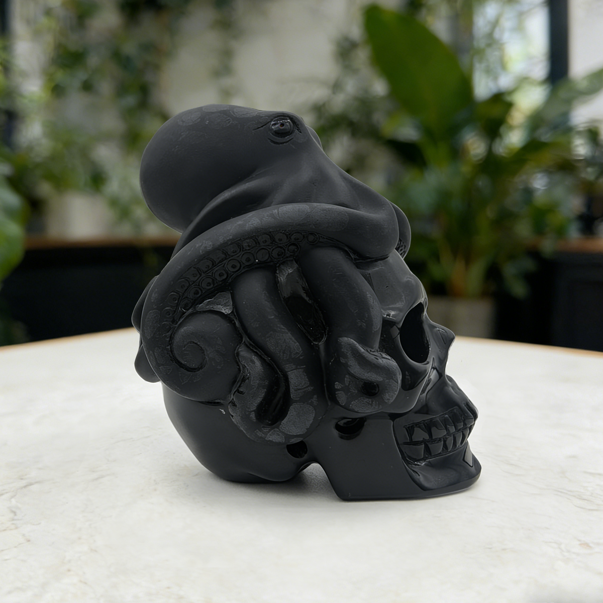Additional view of a Black Obsidian skull and octopus sculpture