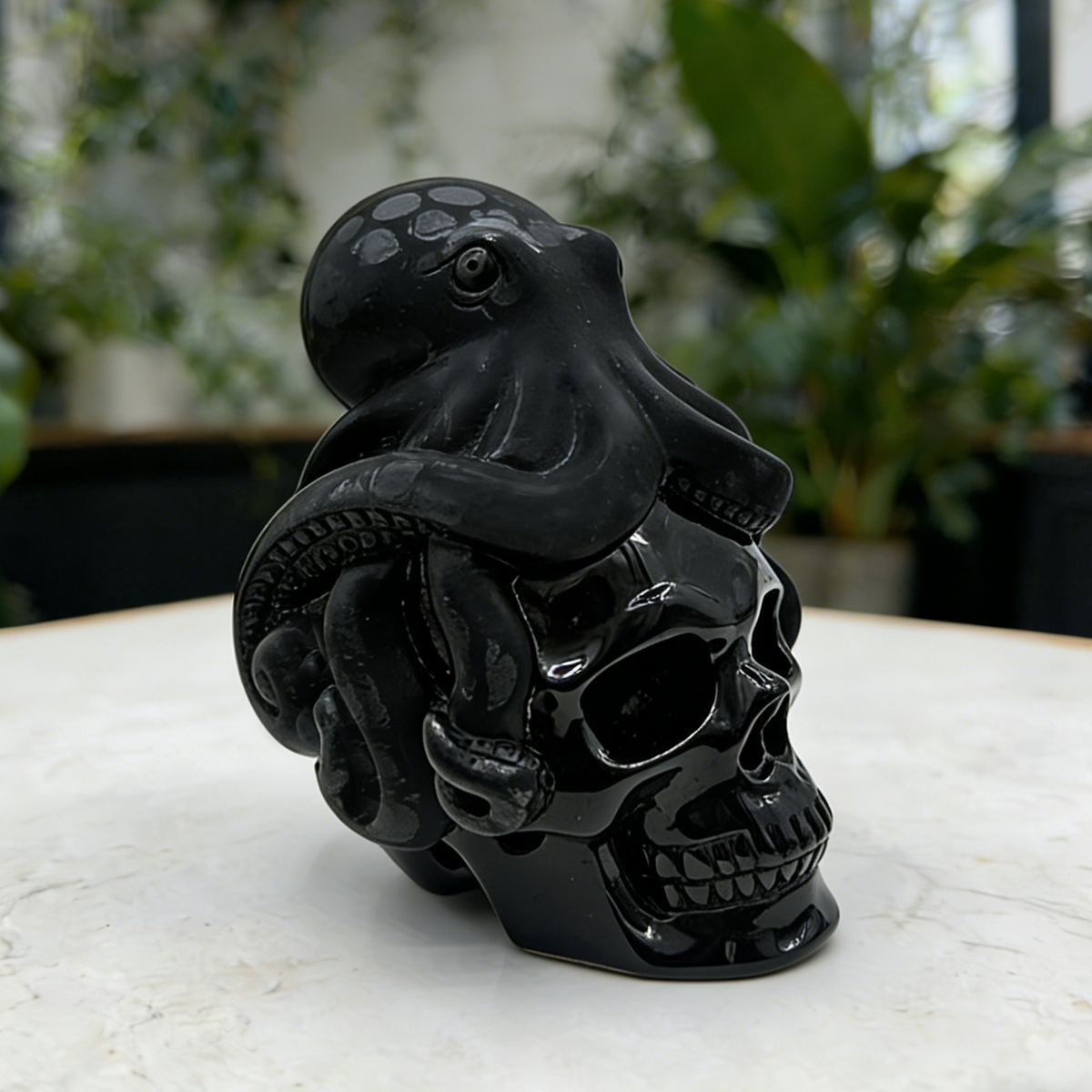Additional view of a Black Obsidian skull and octopus sculpture