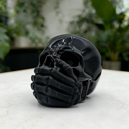 Additional view of a Black Obsidian Speak No Evil skull carving