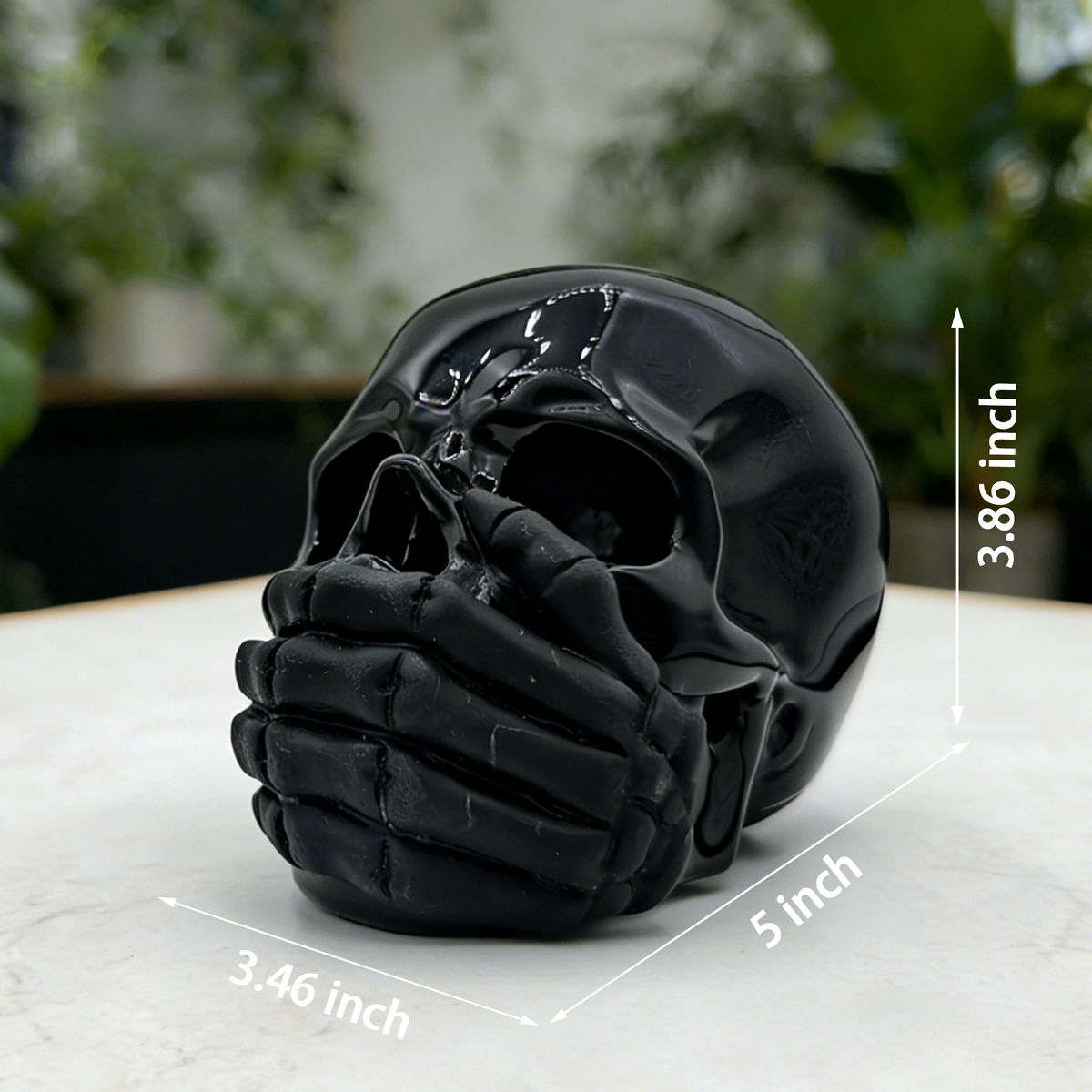 Additional view of a Black Obsidian Speak No Evil skull carving