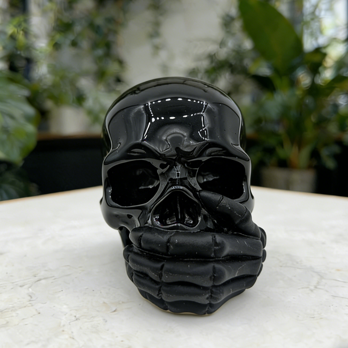 Additional view of a Black Obsidian Speak No Evil skull carving