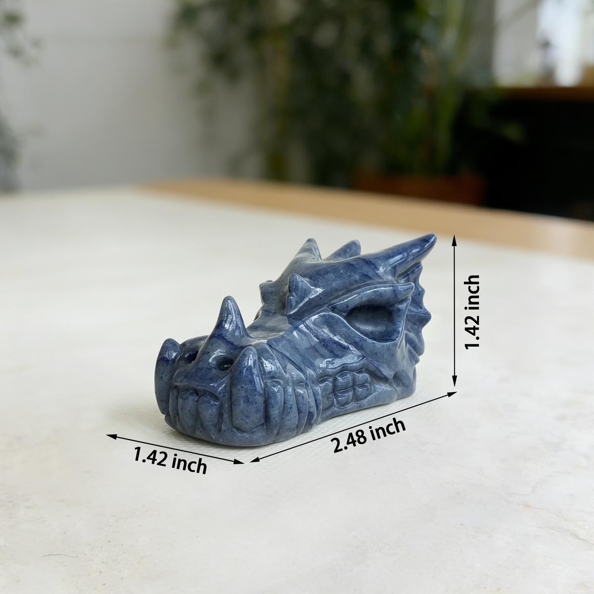 Additional view of a 2.5-inch Blue Aventurine dragon skull carving