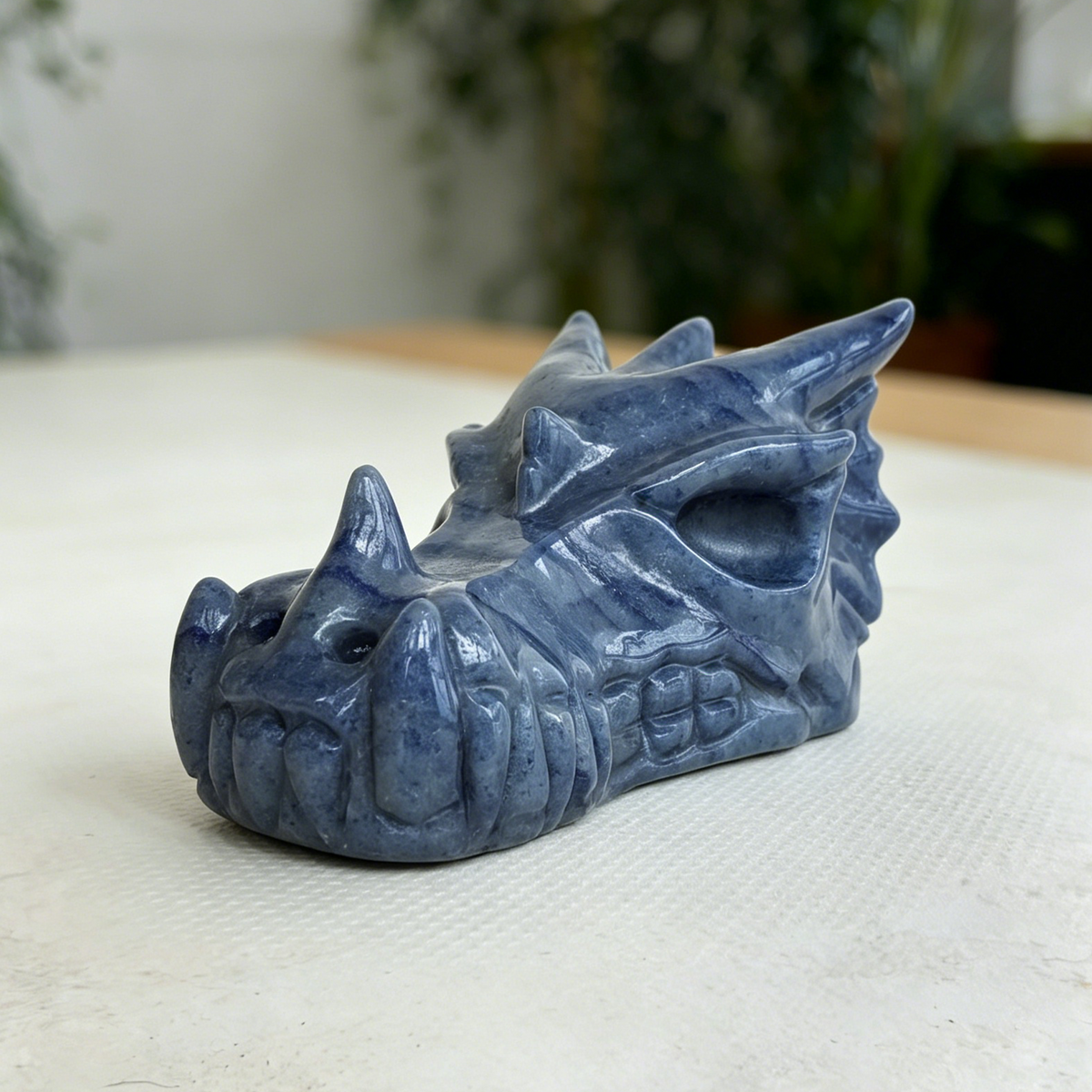 Additional view of a Blue Aventurine dragon skull carving