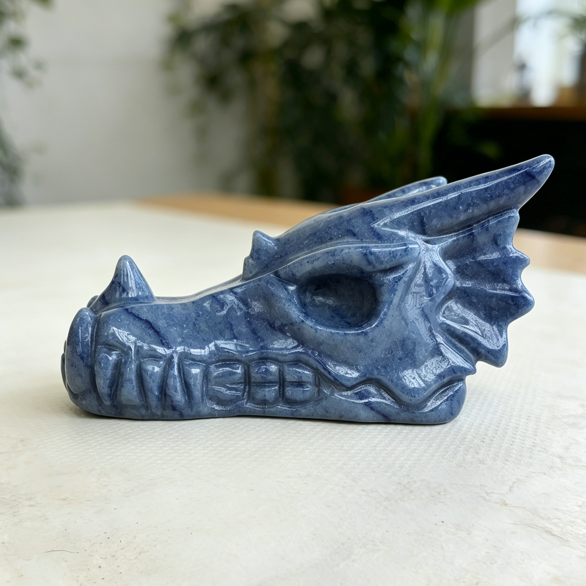 Additional view of a Blue Aventurine dragon skull carving