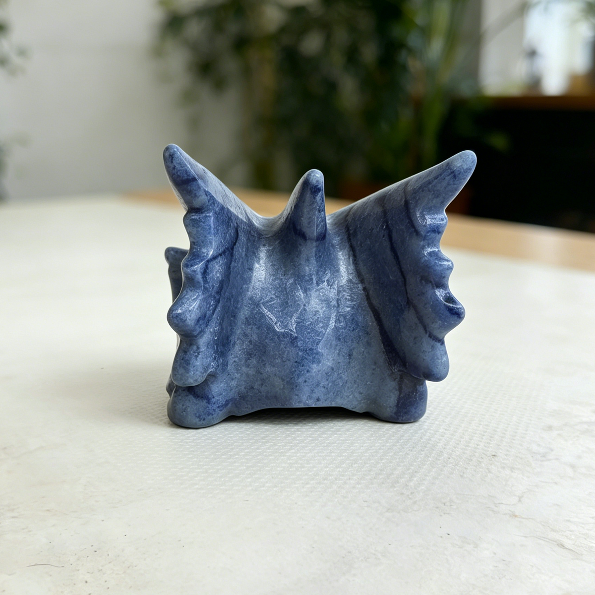 Additional view of a Blue Aventurine dragon skull carving