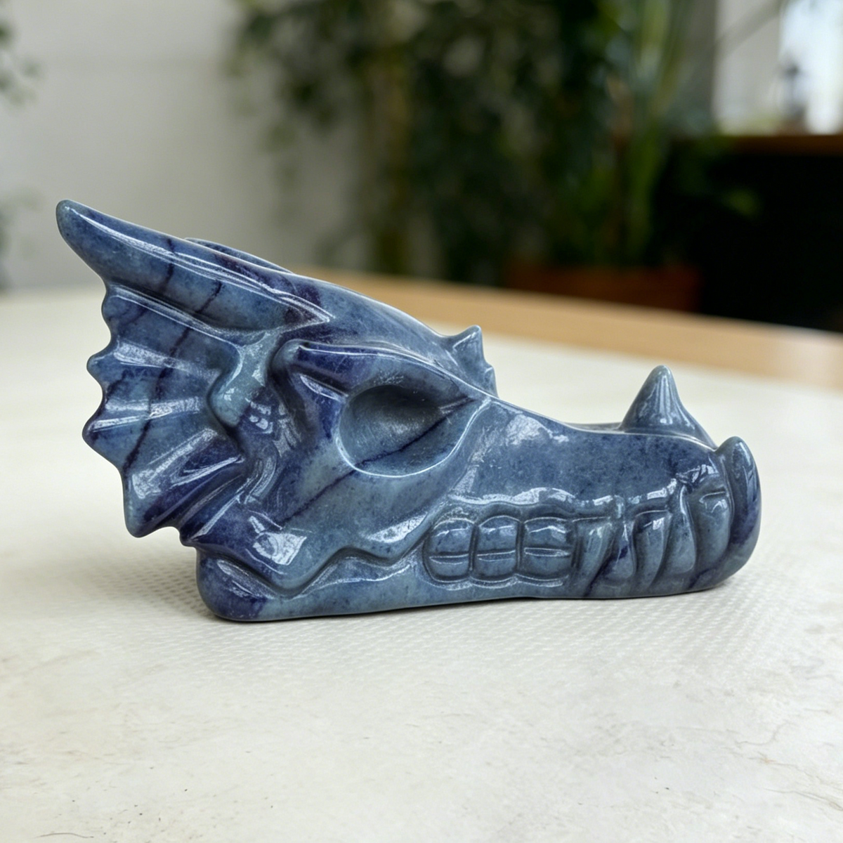 Additional view of a Blue Aventurine dragon skull carving