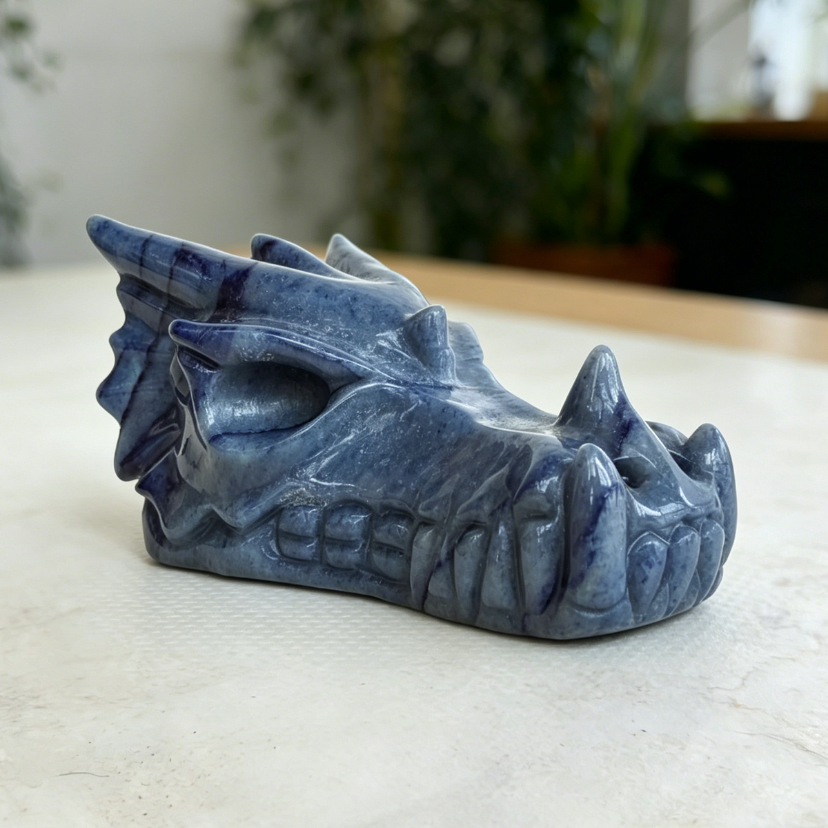 Additional view of a Blue Aventurine dragon skull carving