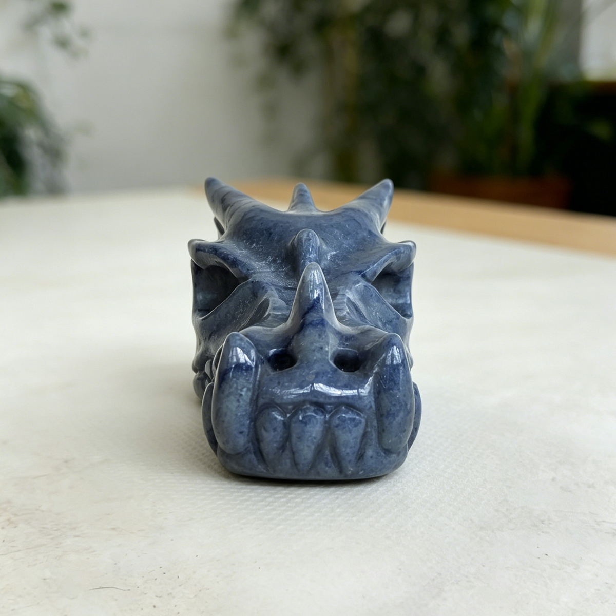 Additional view of a Blue Aventurine dragon skull carving