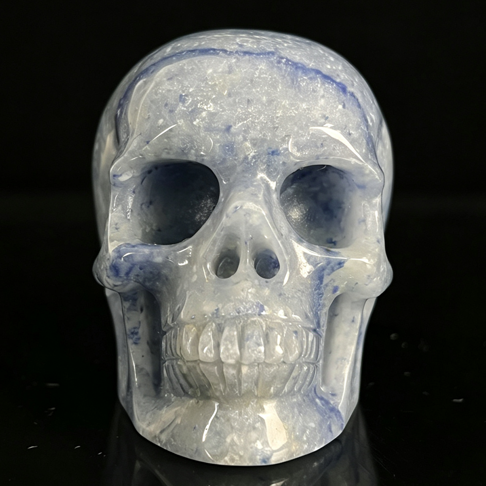Front view of a 2-inch Blue Aventurine human skull carving