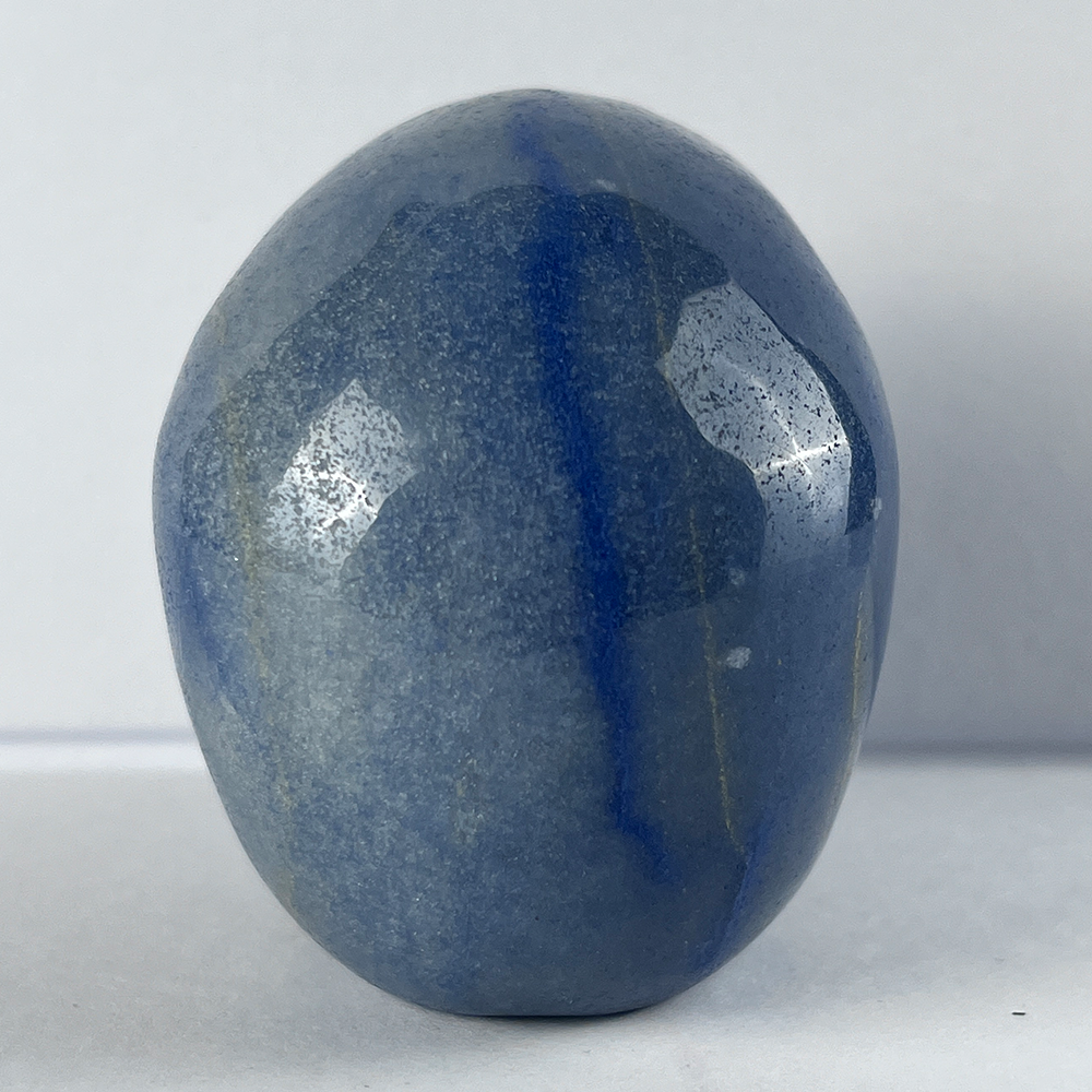 Back view of a 3-inch Blue Aventurine human skull carving