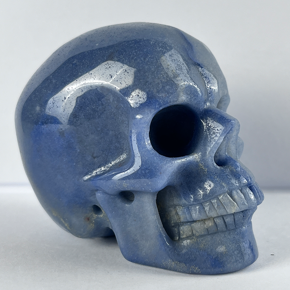 Right-front view of a 3-inch Blue Aventurine human skull carving