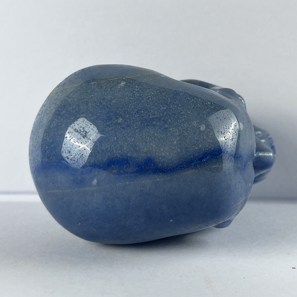 Top view of a 3-inch Blue Aventurine human skull carving
