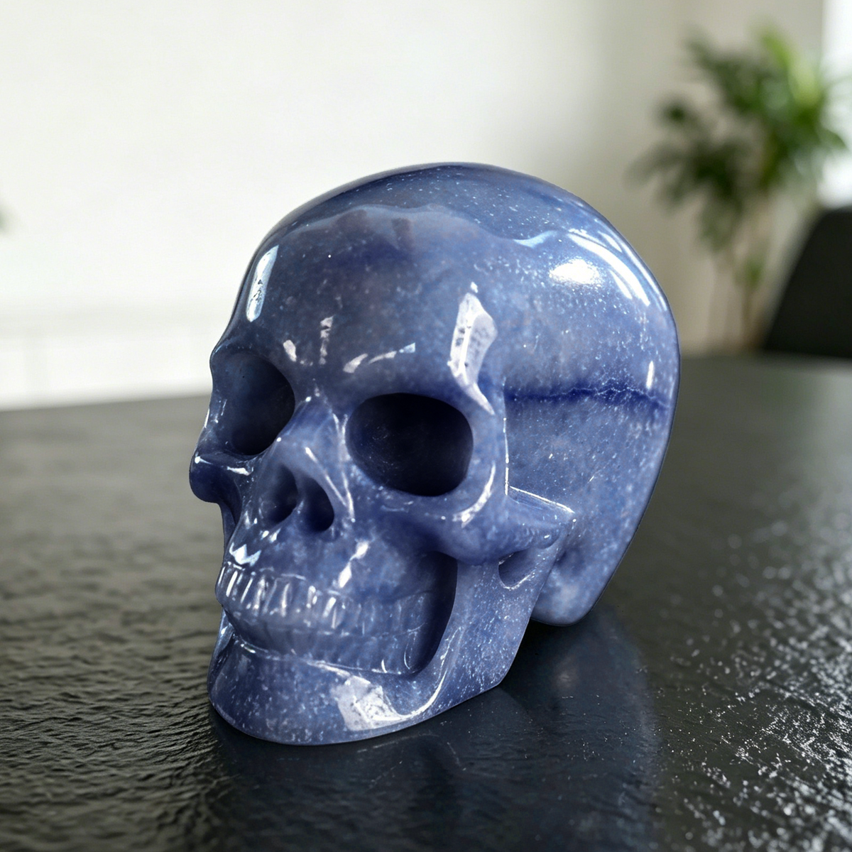 Additional view of a 4.5-inch Blue Aventurine human skull carving