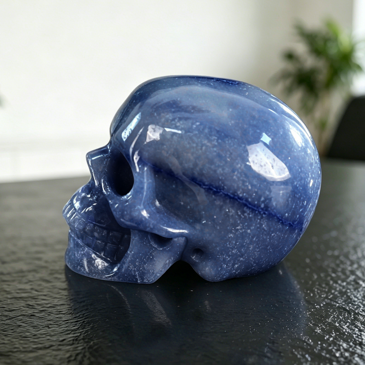 Additional view of a 4.5-inch Blue Aventurine human skull carving