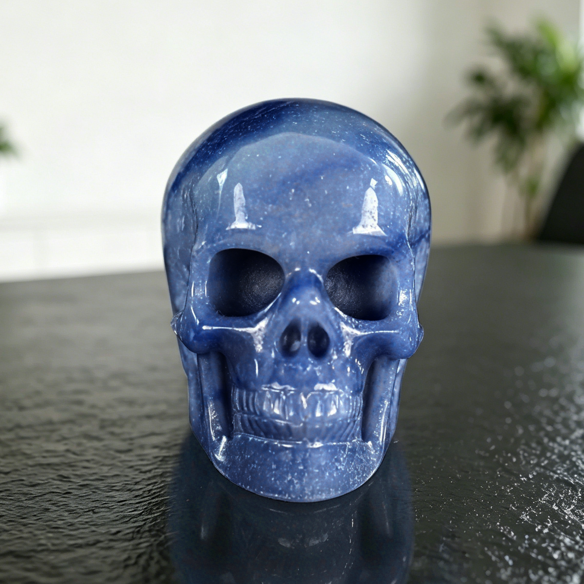 Additional view of a 4.5-inch Blue Aventurine human skull carving