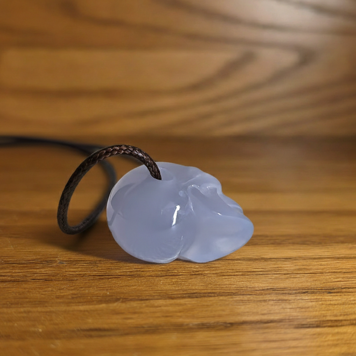 Additional view of a 1-inch Blue Chalcedony human skull pendant carving