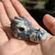 Additional view of a 2-inch Blue Flower Agate dragon skull carving