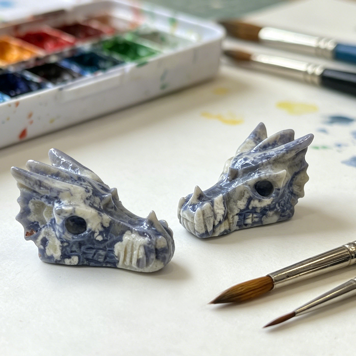 Additional view of a 2-inch Blue Flower Agate dragon skull carving