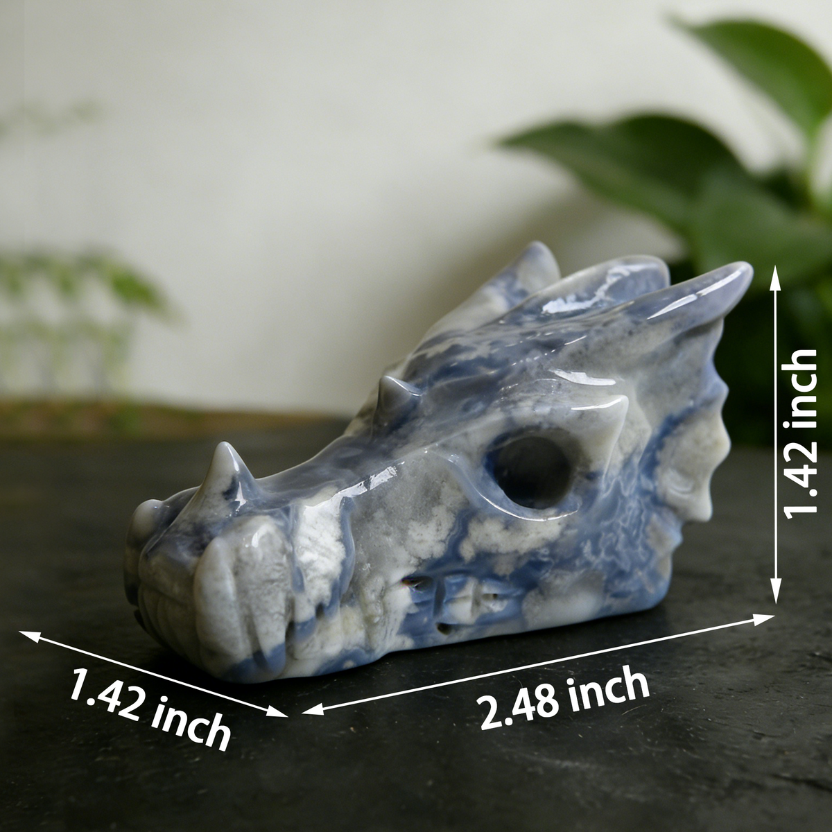 Additional view of a 2.5-inch Blue Flower Agate dragon skull carving