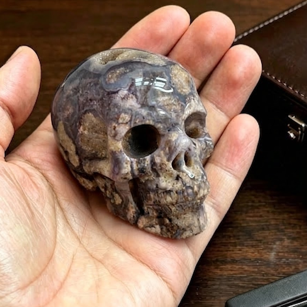 Main view of a 2-inch Blue Flower Agate human skull carving