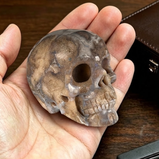 Main view of a 2-inch Blue Flower Agate human skull carving