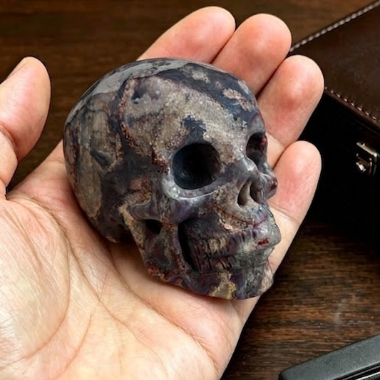 Main view of a 2-inch Blue Flower Agate human skull carving