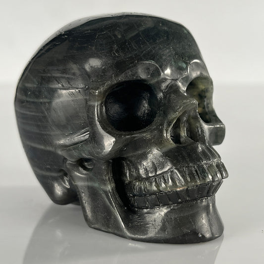 Right-front view of a 3-inch Blue Labradorite human skull carving