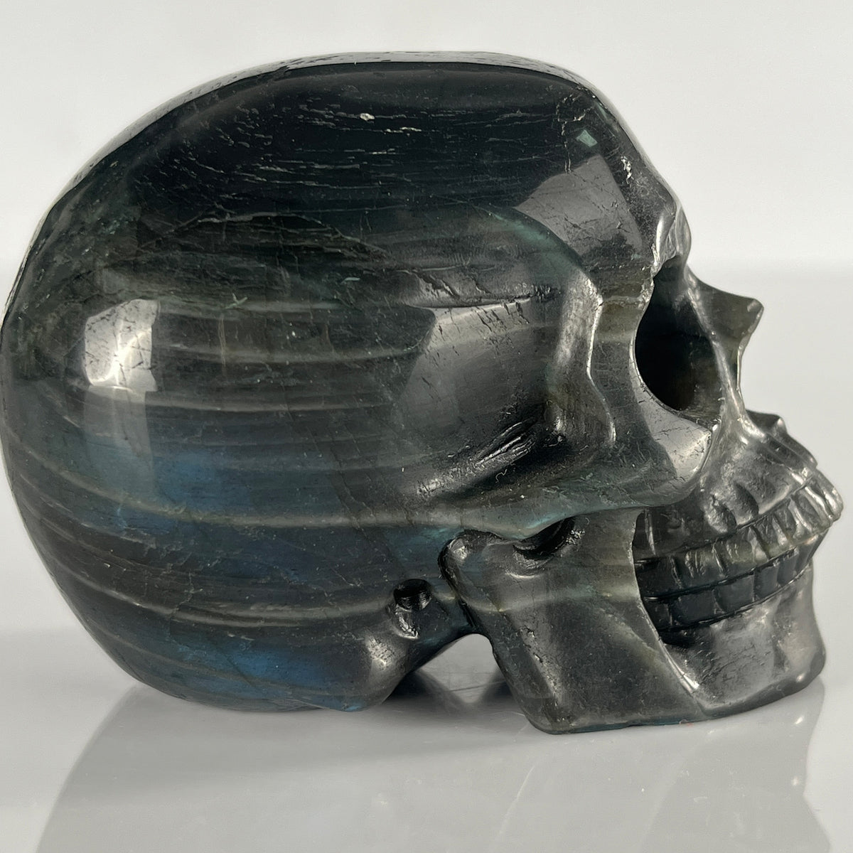 Right view of a 3-inch Blue Labradorite human skull carving