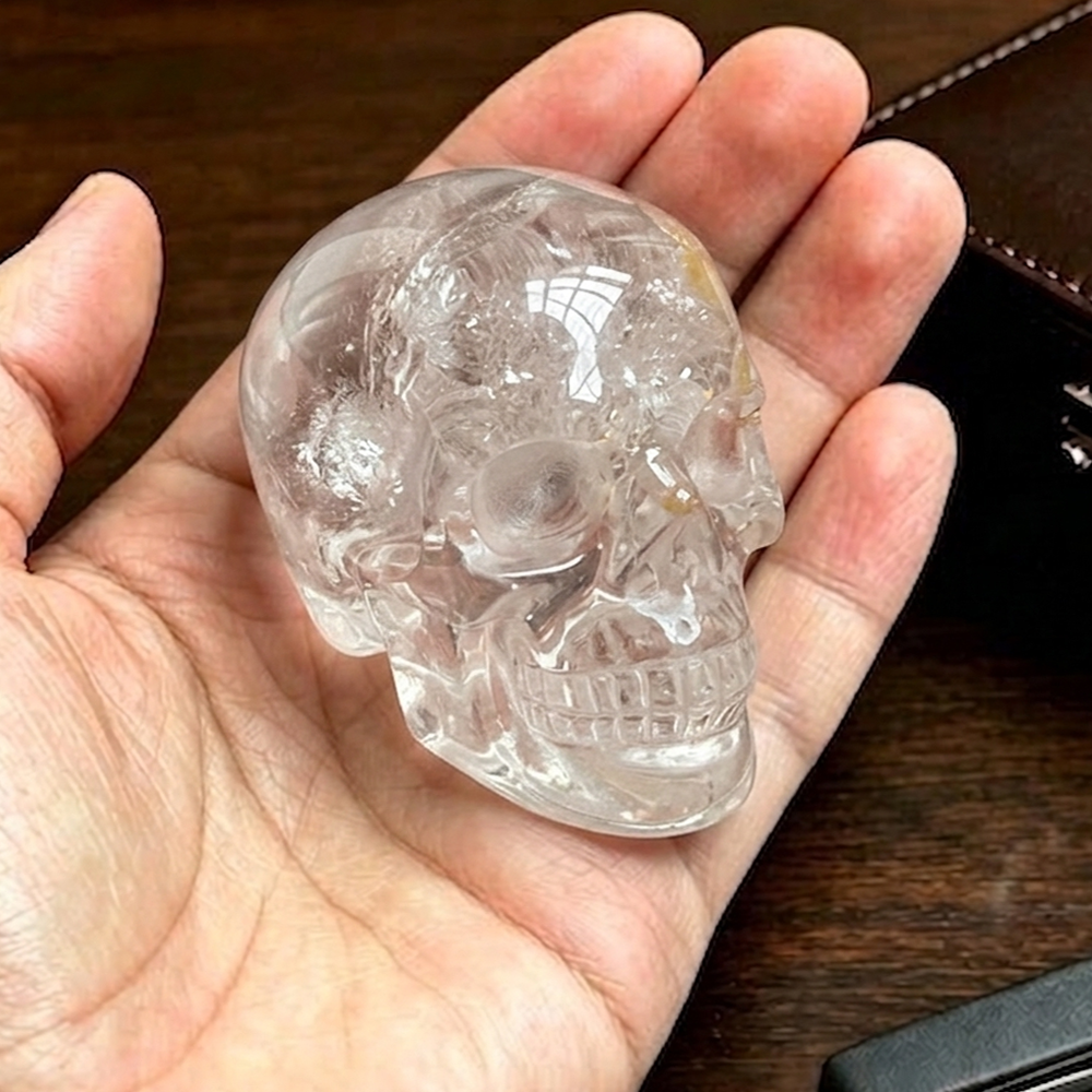 Additional view of a 2-inch Clear Quartz human skull carving