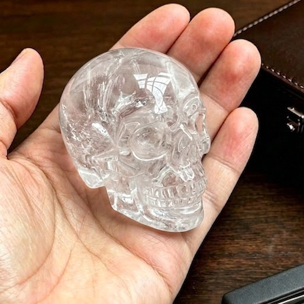 Additional view of a 2-inch Clear Quartz human skull carving