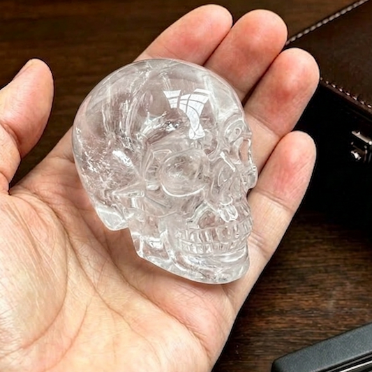 Additional view of a 2-inch Clear Quartz human skull carving