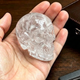 Additional view of a 2-inch Clear Quartz human skull carving